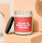 Glass candle with red label reading "You Said Yes Before You Saw The Dress."