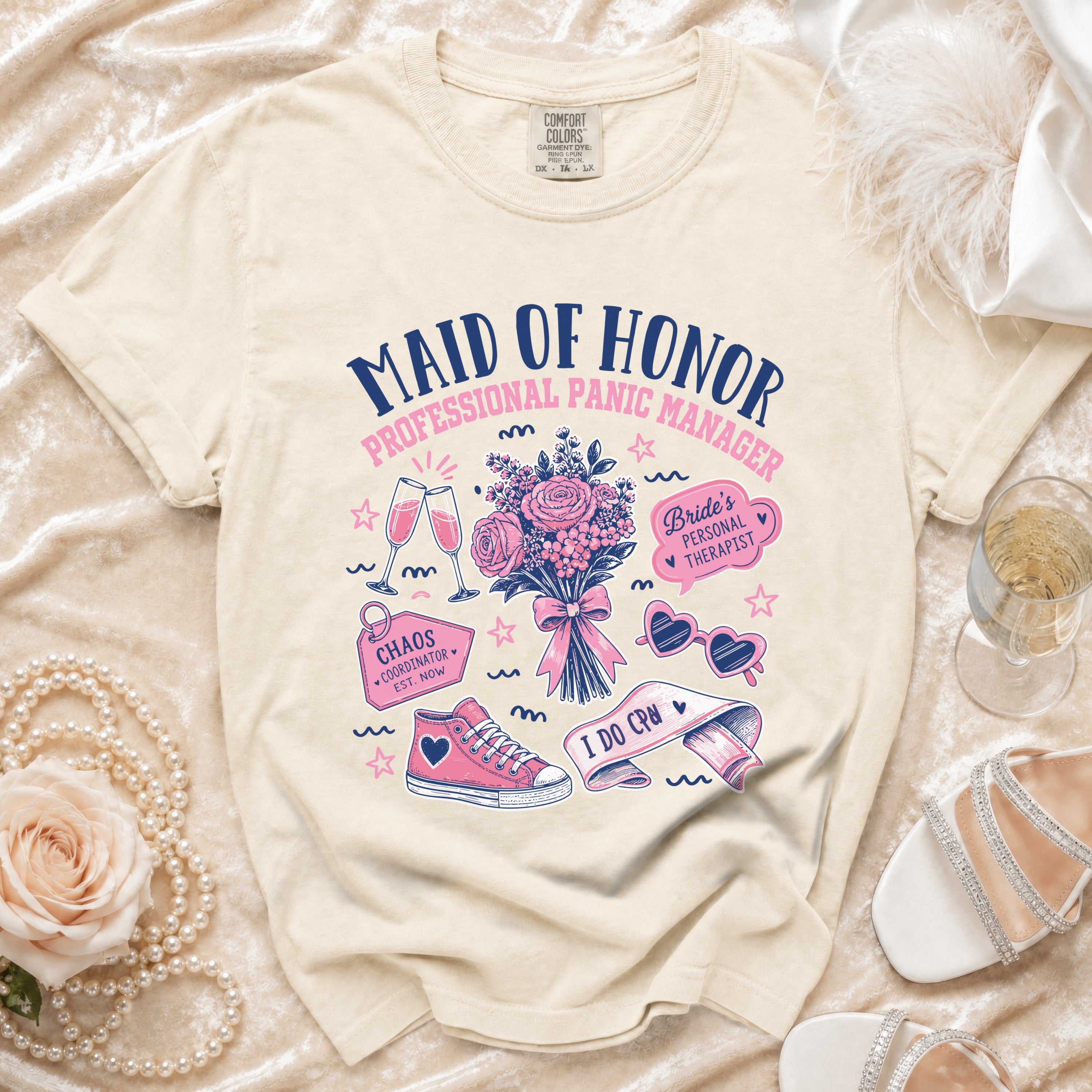 Cream t-shirt with "Maid of Honor Professional Panic Manager" graphic.