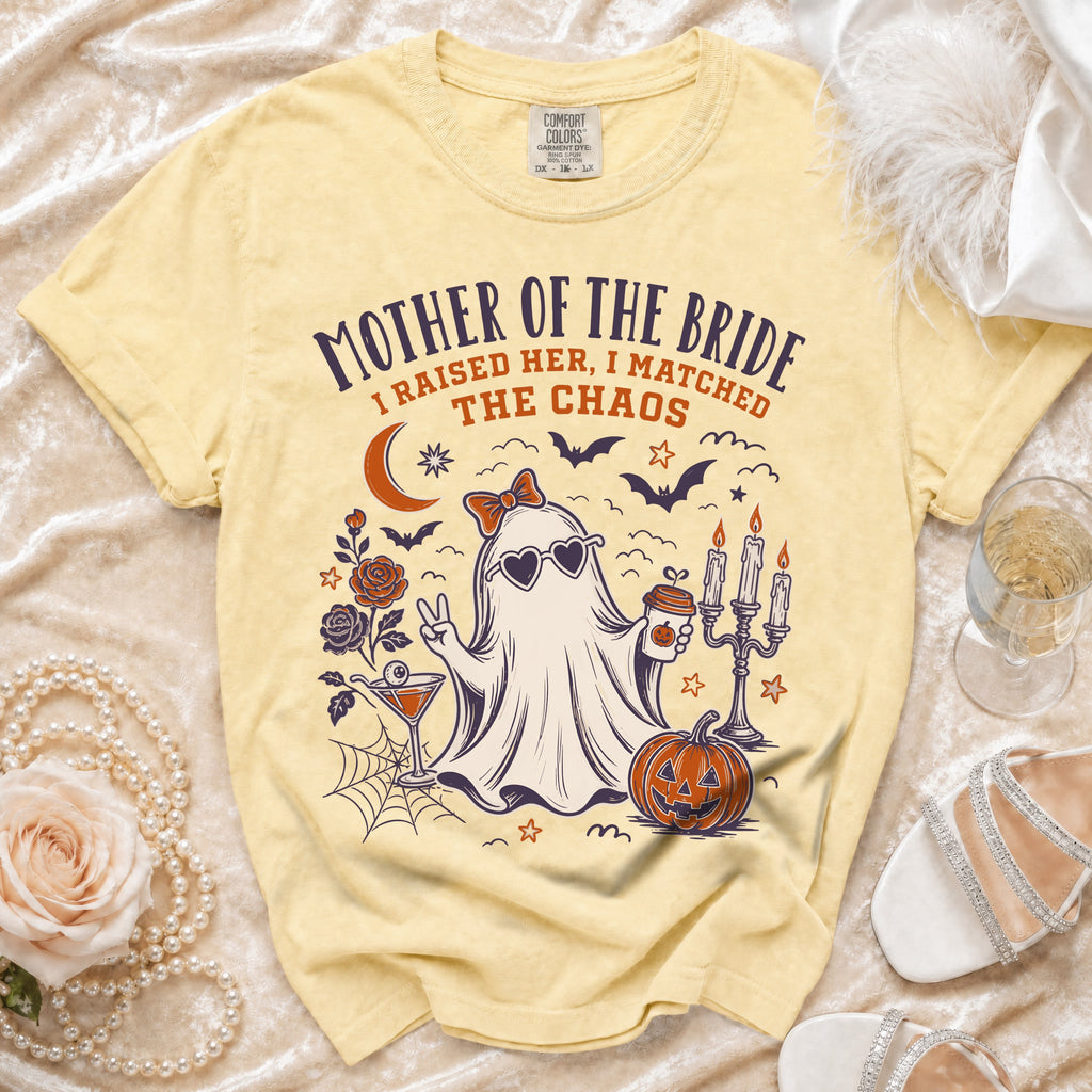 Yellow t-shirt with "Mother of the Bride" graphic of a ghost, pumpkin, and cocktail.