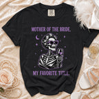 Black t-shirt with skeleton graphic, "Mother of the Bride, My Favorite Title." text.