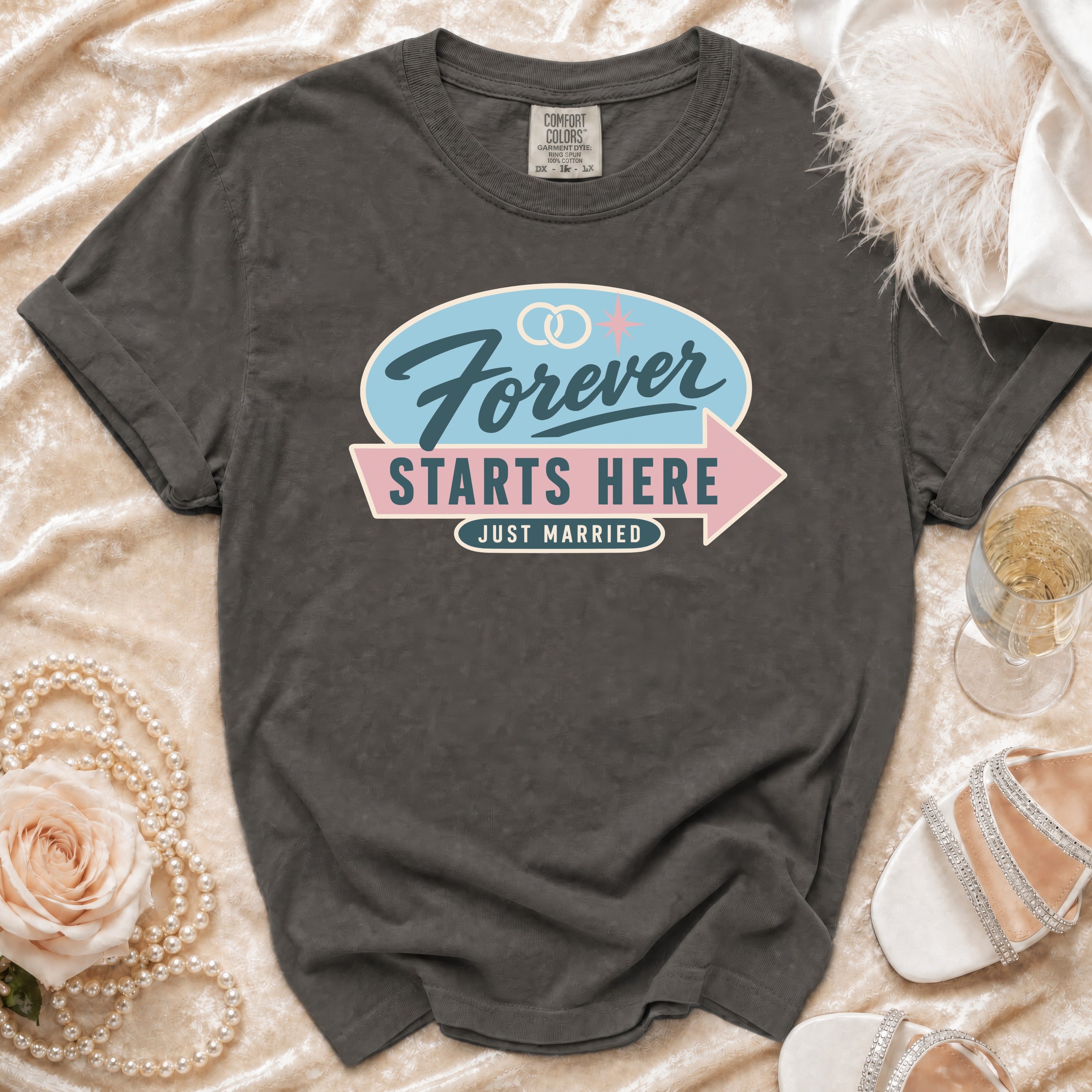 Dark gray t-shirt with "Forever Starts Here Just Married" text and wedding rings.