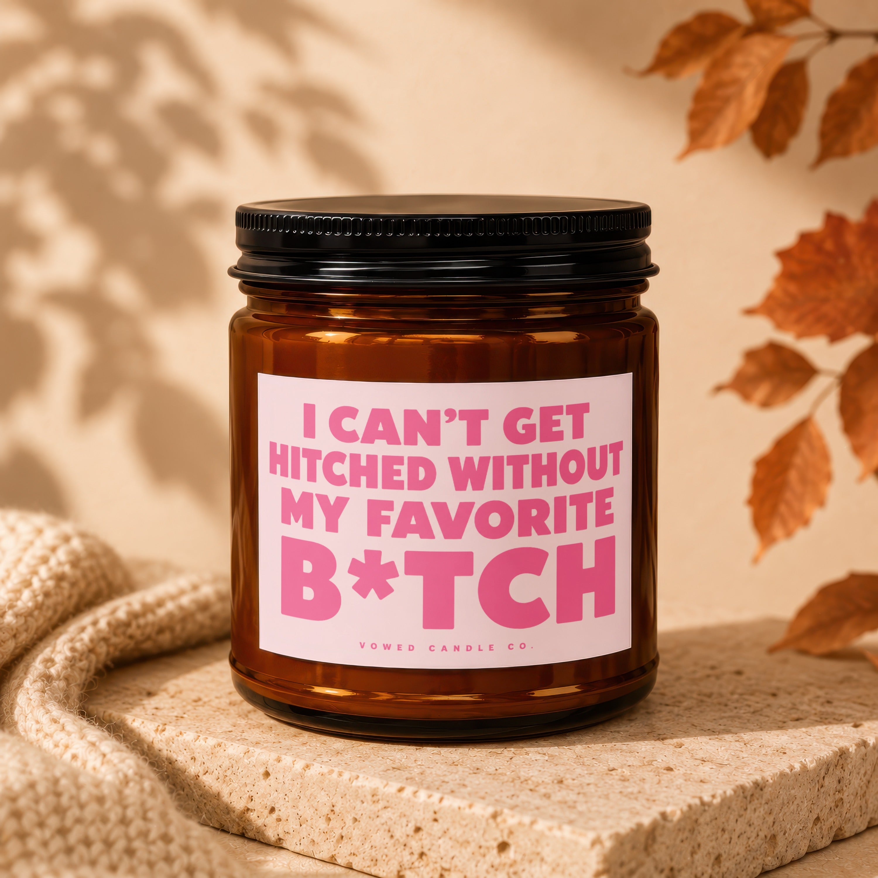 Brown candle with pink label reading "I can't get hitched without my favorite B*tch".