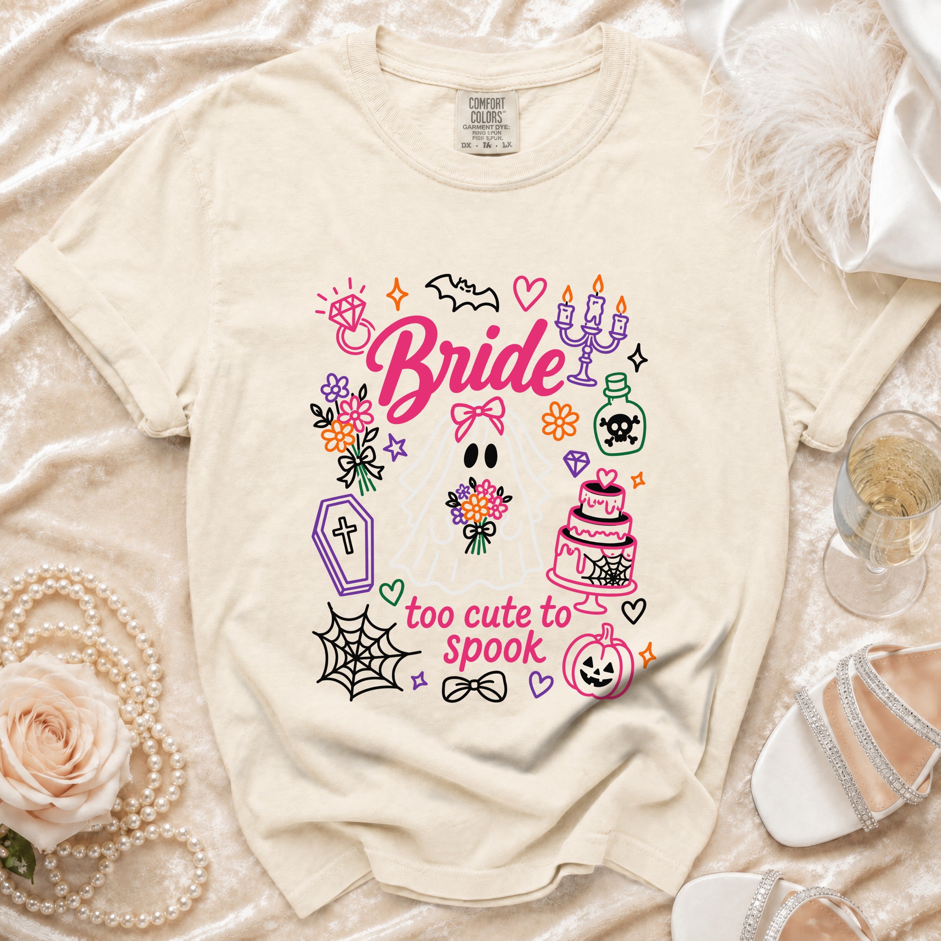 Cream t-shirt with "Bride" and "too cute to spook" graphic.
