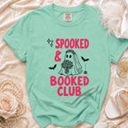Mint green t-shirt with "Spooked & Booked Club" text and ghost bride graphic.