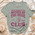 Proud Mother of the Bride Club est. 2026 shirt with champagne glass graphic.