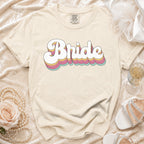 Comfort Colors t-shirt with "Bride" in retro-style font, styled with pearls and heels.