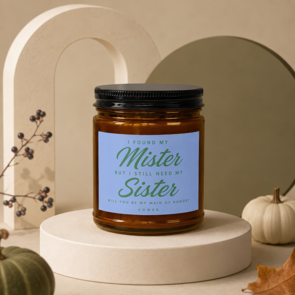 Candle with text "I found my Mister but I still need my Sister" on blue label.