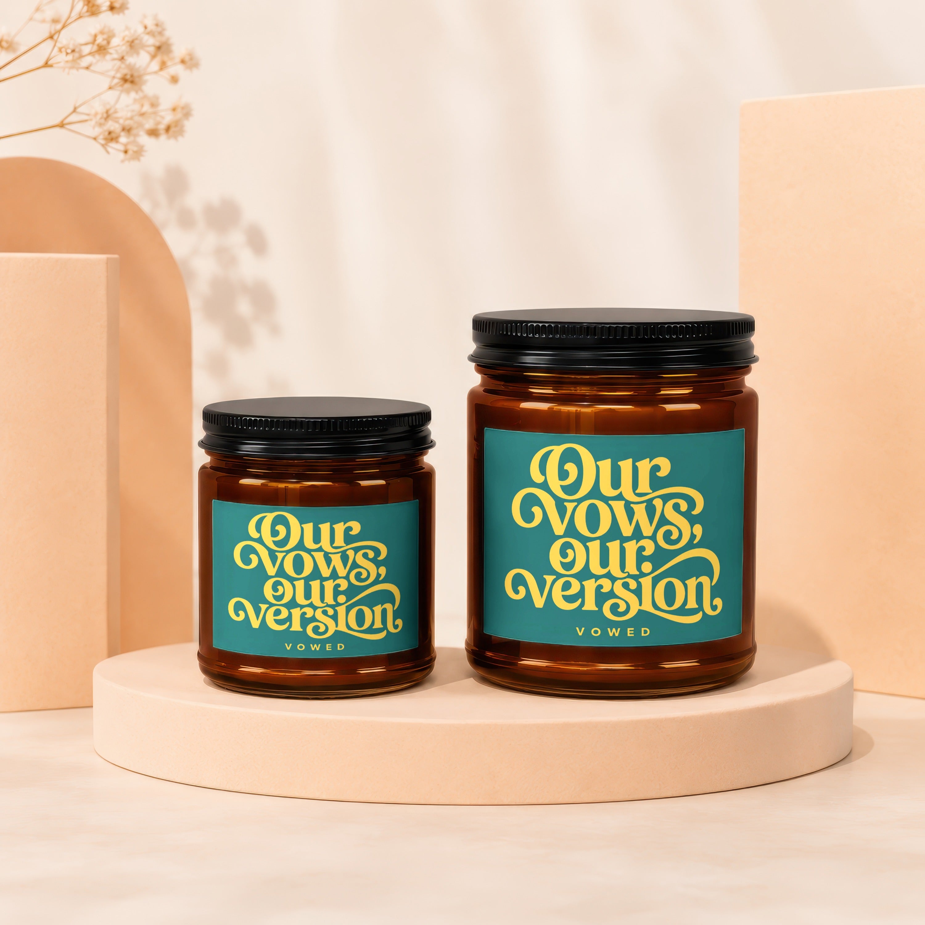 Amber glass jar candle with teal label reading "Our Vows, Our Version"