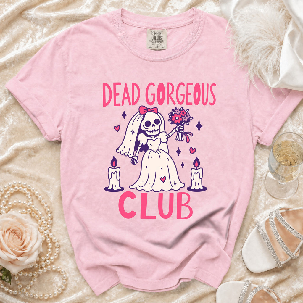 Pink t-shirt with "Dead Gorgeous Club" text and a skeleton bride graphic.