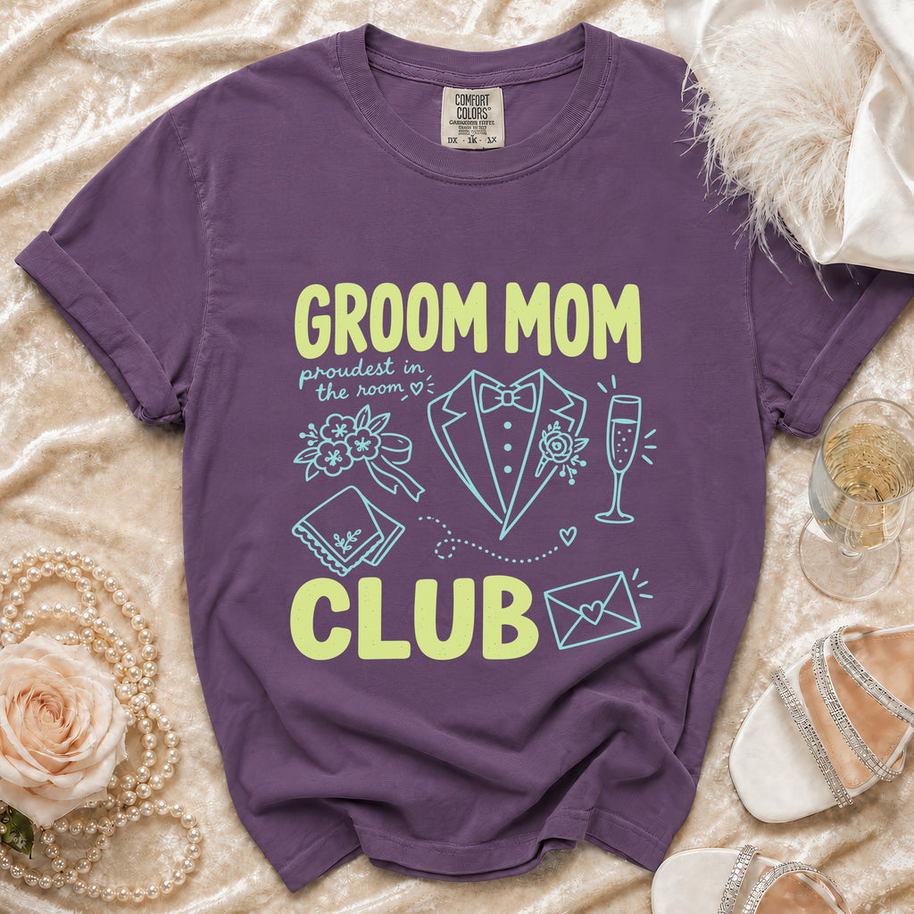 Purple t-shirt with "Groom Mom Club" text and wedding icons.