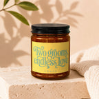 Amber jar candle with yellow label reading "Two grooms, endless love" and "VOWED".