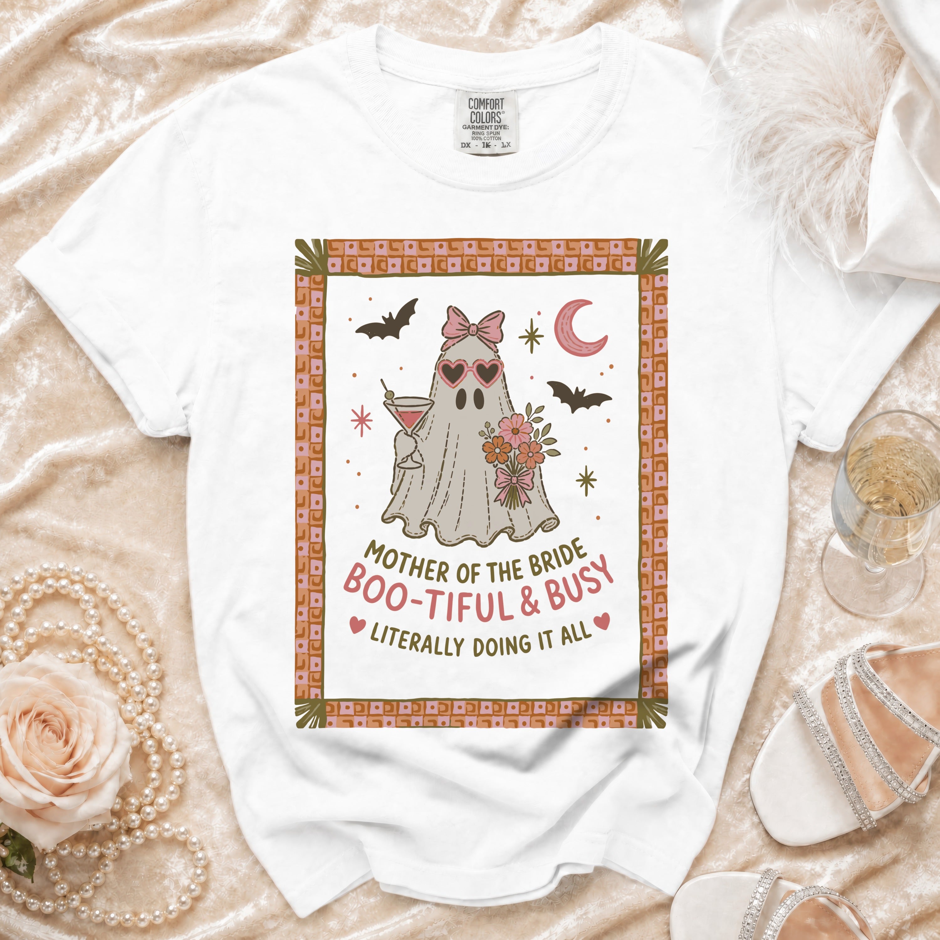 White t-shirt with a ghost graphic saying "Mother of the Bride Boo-tiful & Busy".