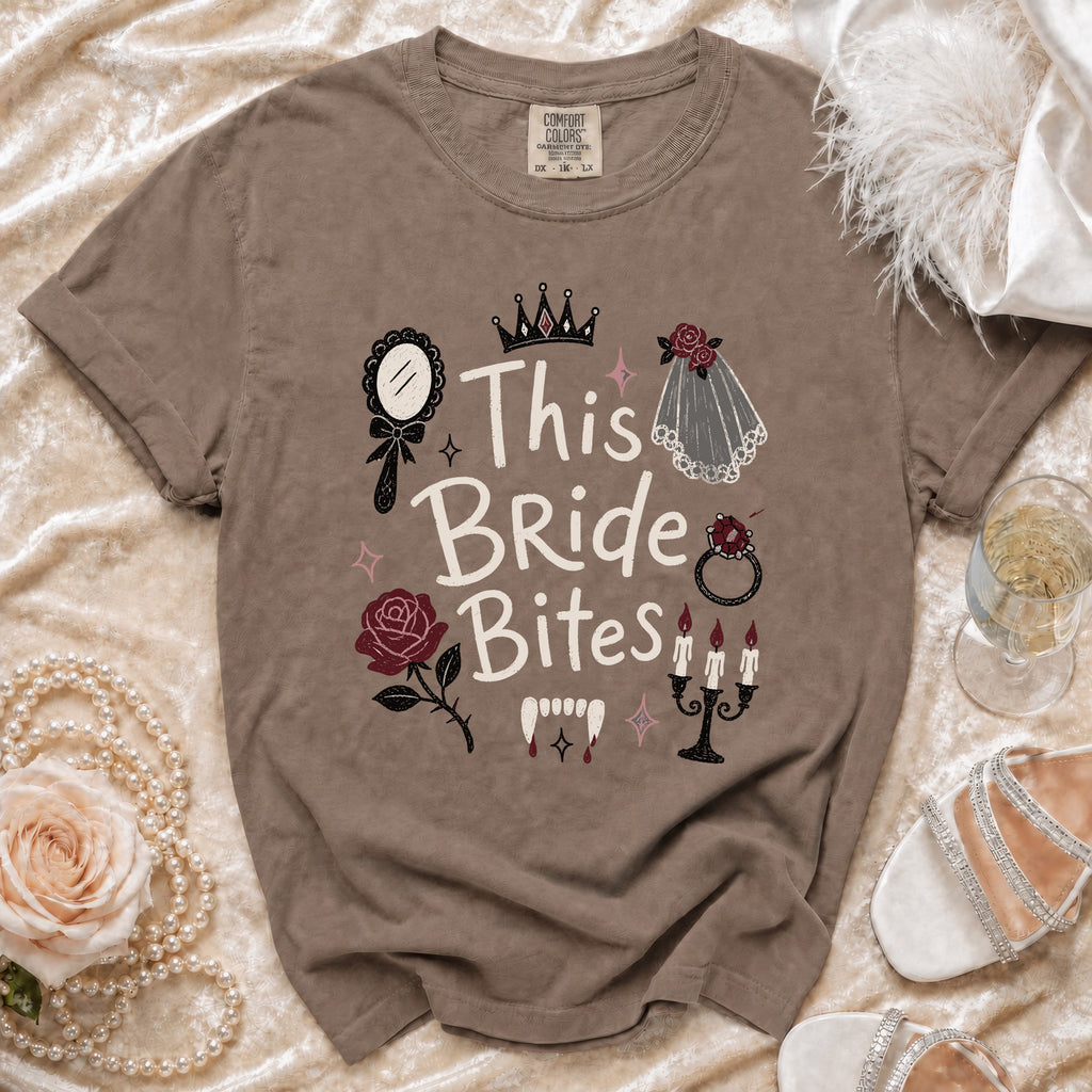 Brown t-shirt with "This Bride Bites" text, vampire fangs, and bridal graphics.