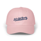 Light pink baseball cap featuring embroidered navy blue text that reads Let's Get Rowdy.
