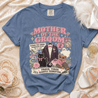 Blue t-shirt with "Mother of the Groom" graphic, tuxedo, cat, bear, and text.
