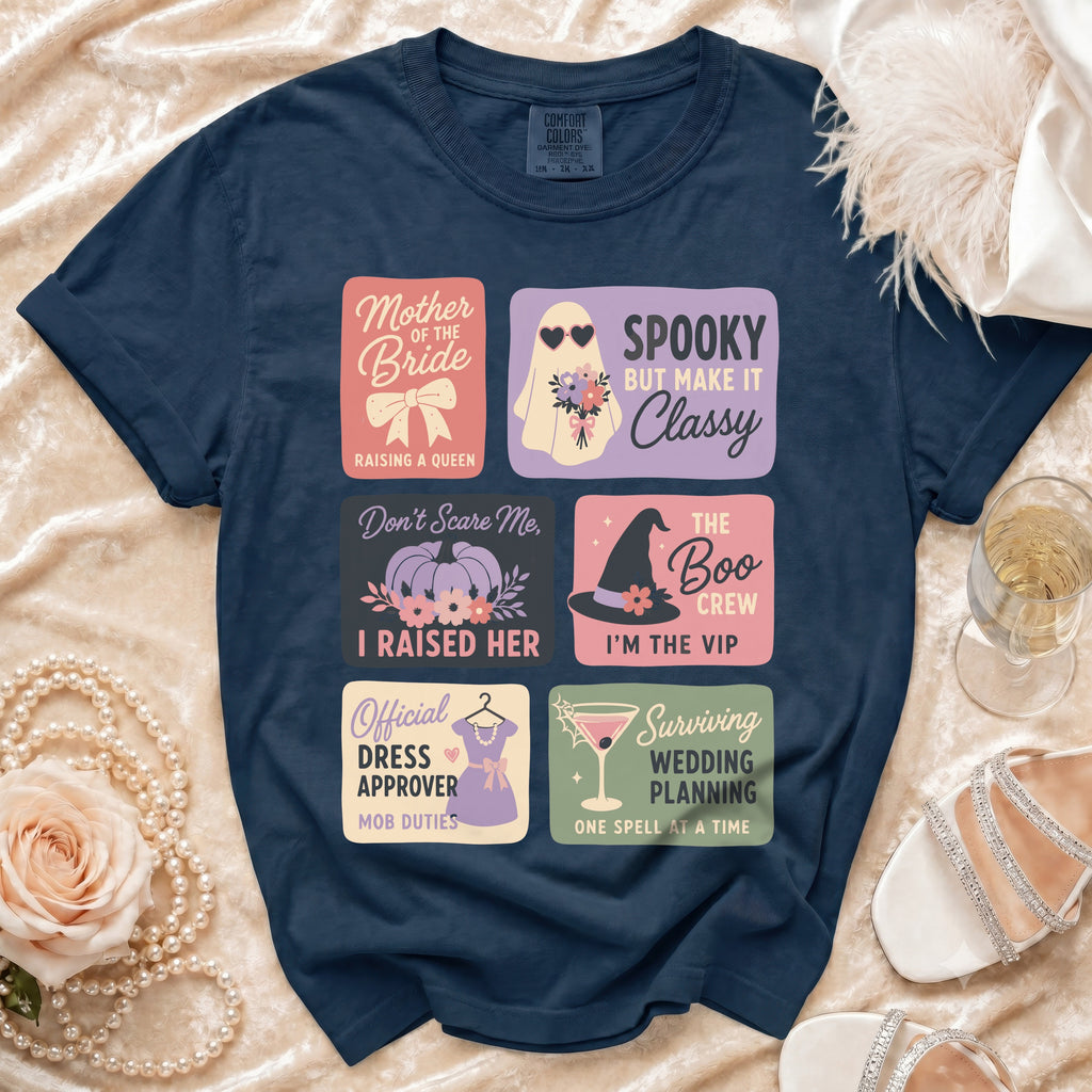 Navy t-shirt with six Halloween-themed wedding squares: Mother of the Bride, Spooky but Make It Classy, Don't Scare Me I Raised Her, The Boo Crew I'm the VIP, Official Dress Approver Mob Duties, Surviving Wedding Planning One Spell at a Time.