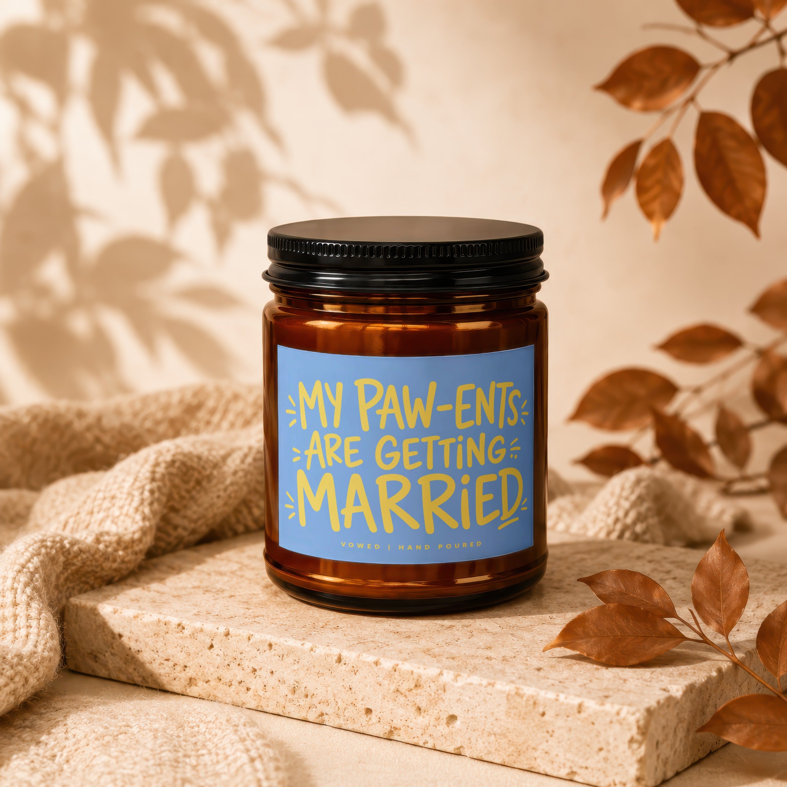 Amber candle jar with blue label stating "My Paw-ents Are Getting Married".