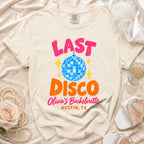 Cream t-shirt with "LAST DISCO Olivia's Bachelorette Austin, TX" graphic.
