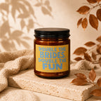 Amber candle with yellow label saying "Double the Brides. Double the Fun."