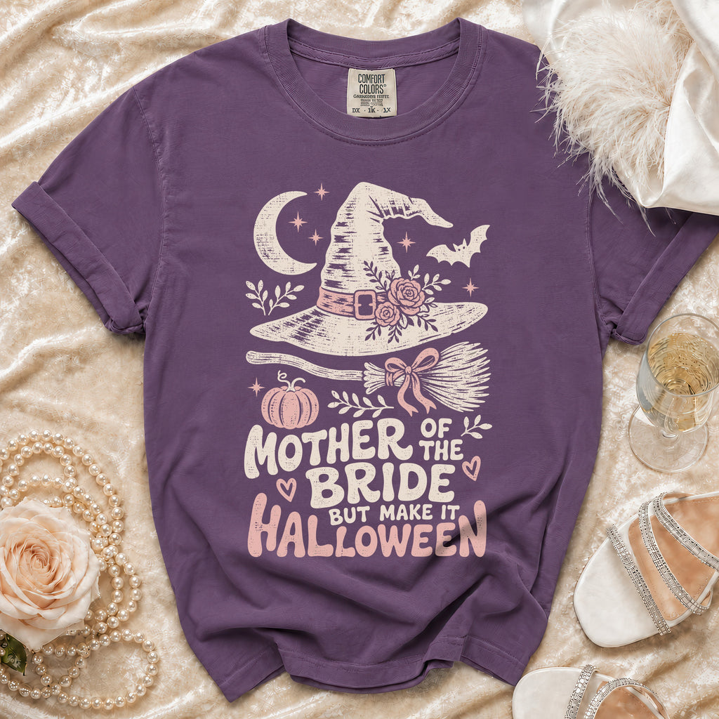 Purple t-shirt with "Mother of the Bride but Make it Halloween" graphic and Halloween elements.