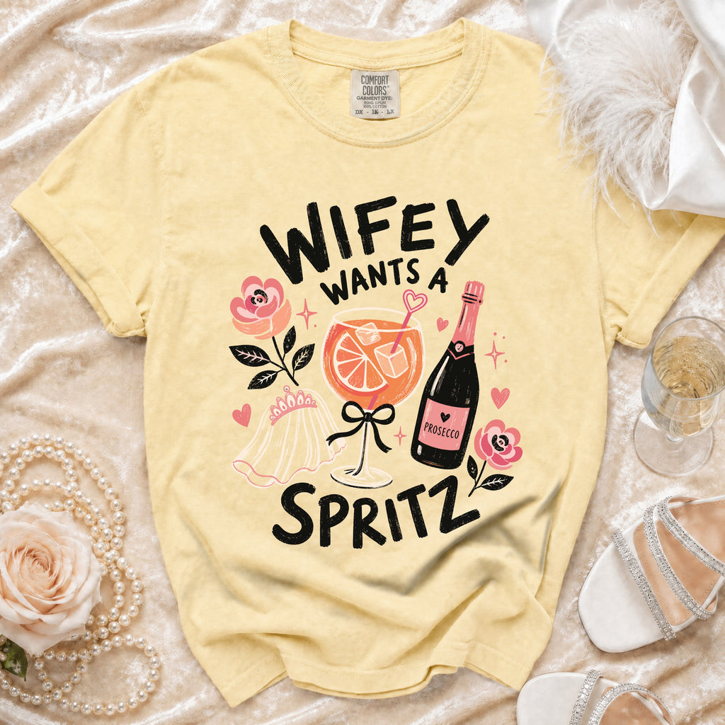 Yellow t-shirt with "Wifey Wants a Spritz" graphic, prosecco bottle, and cocktail.