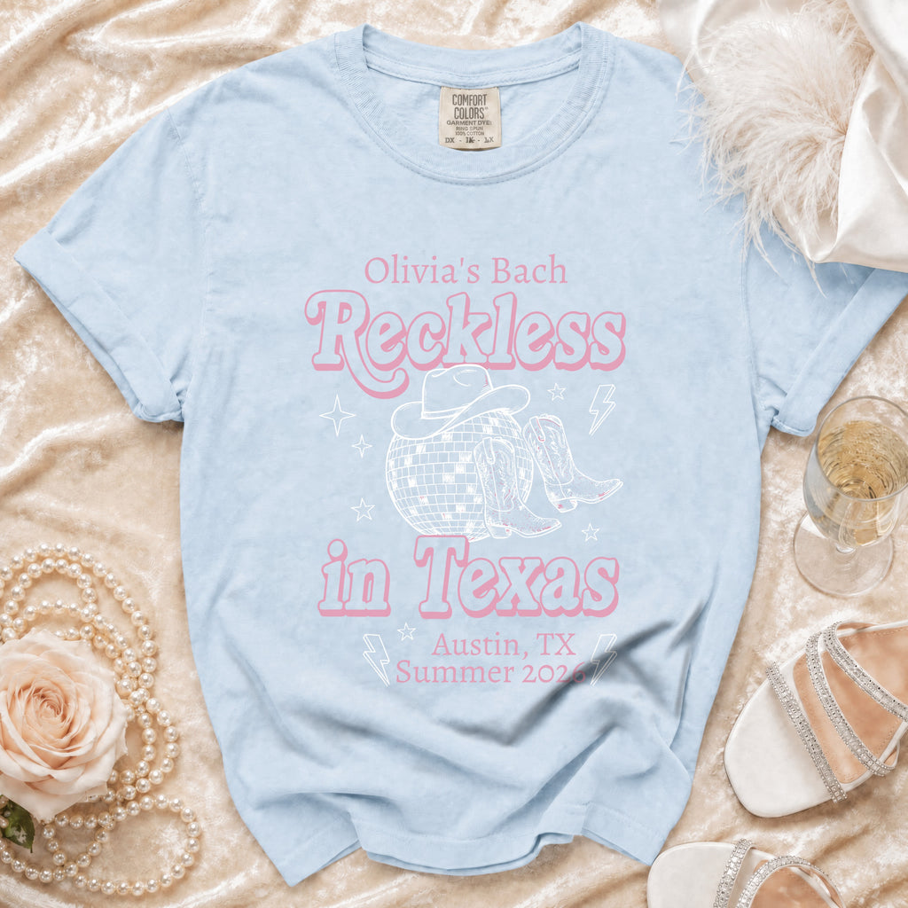 Light blue t-shirt with "Olivia's Bach Reckless in Texas Austin, TX Summer 2026".