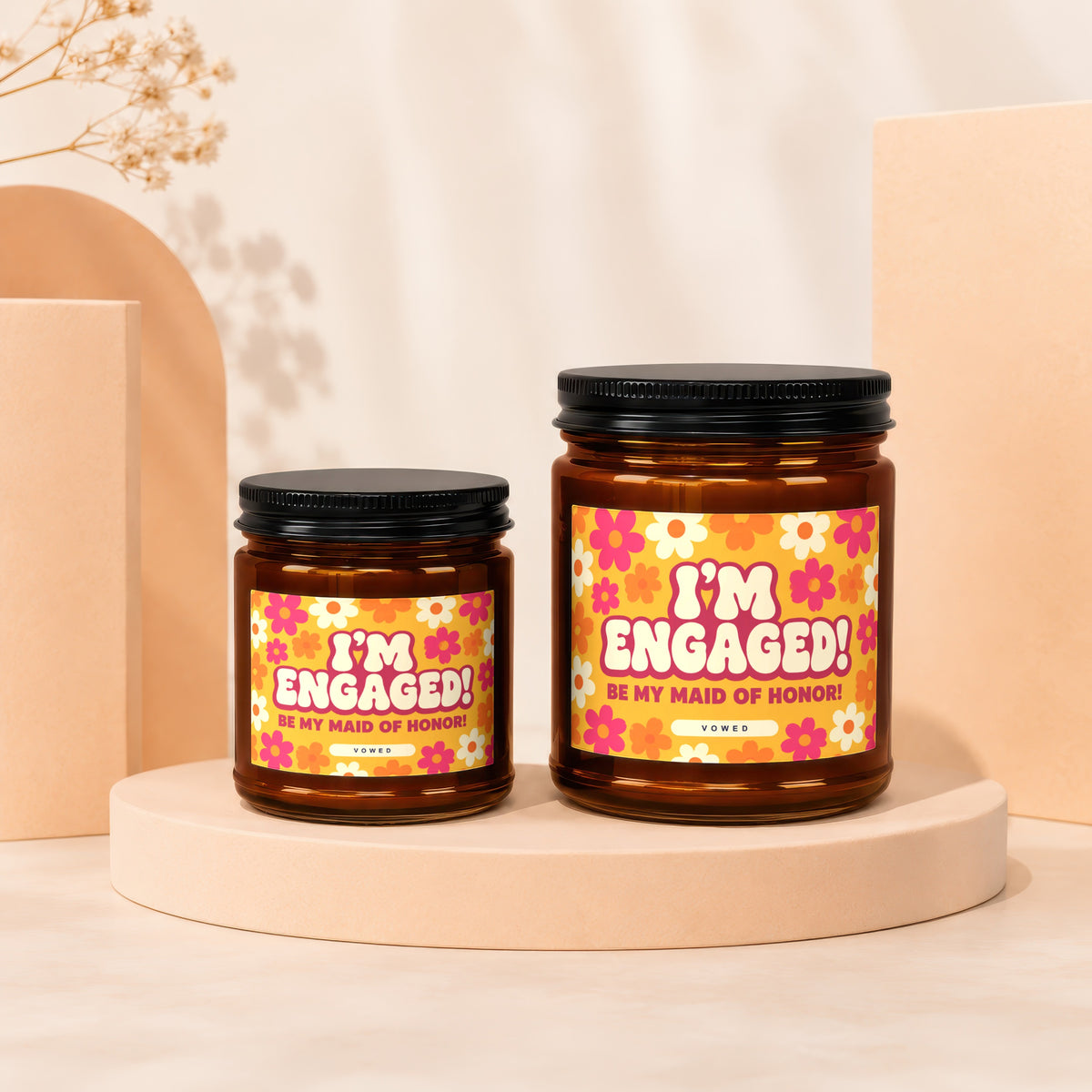 Two amber candles with floral labels read "I'm Engaged! Be My Maid of Honor!"