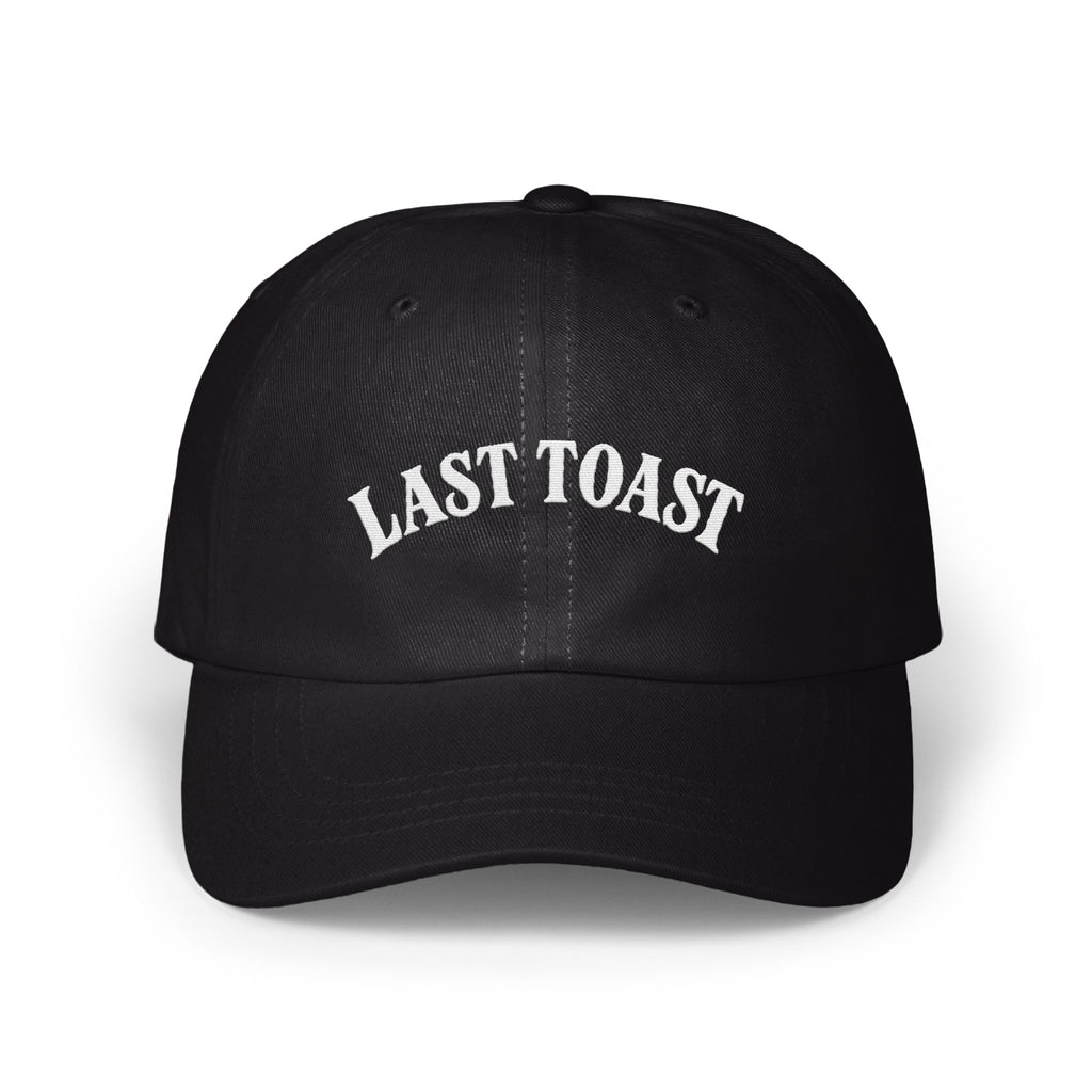 Black baseball cap with white embroidered "LAST TOAST" text on the front.