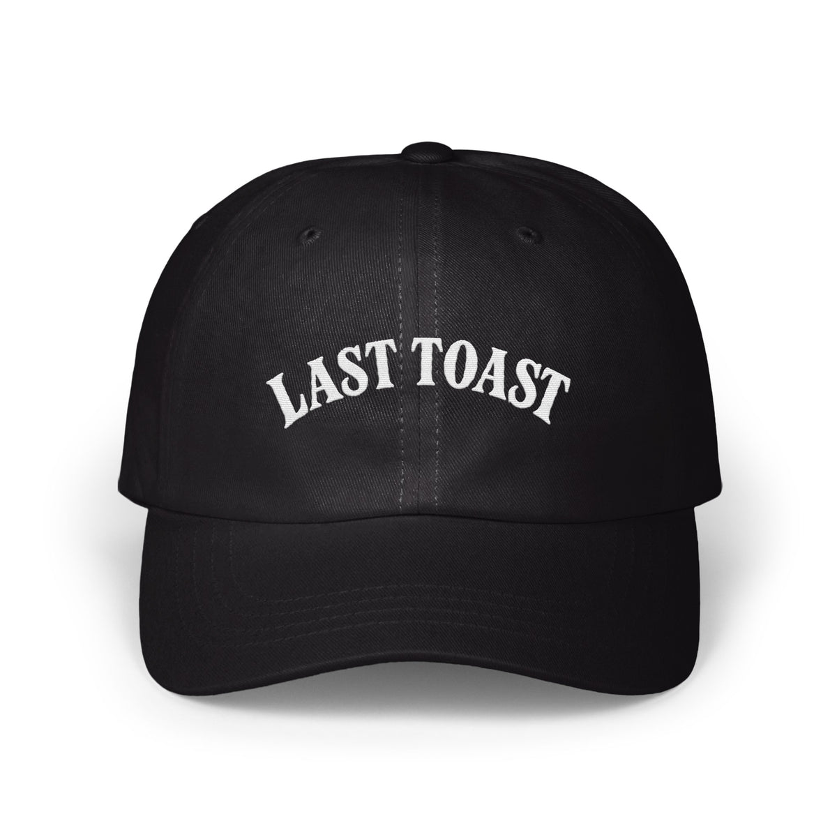 Black baseball cap with white embroidered "LAST TOAST" text on the front.