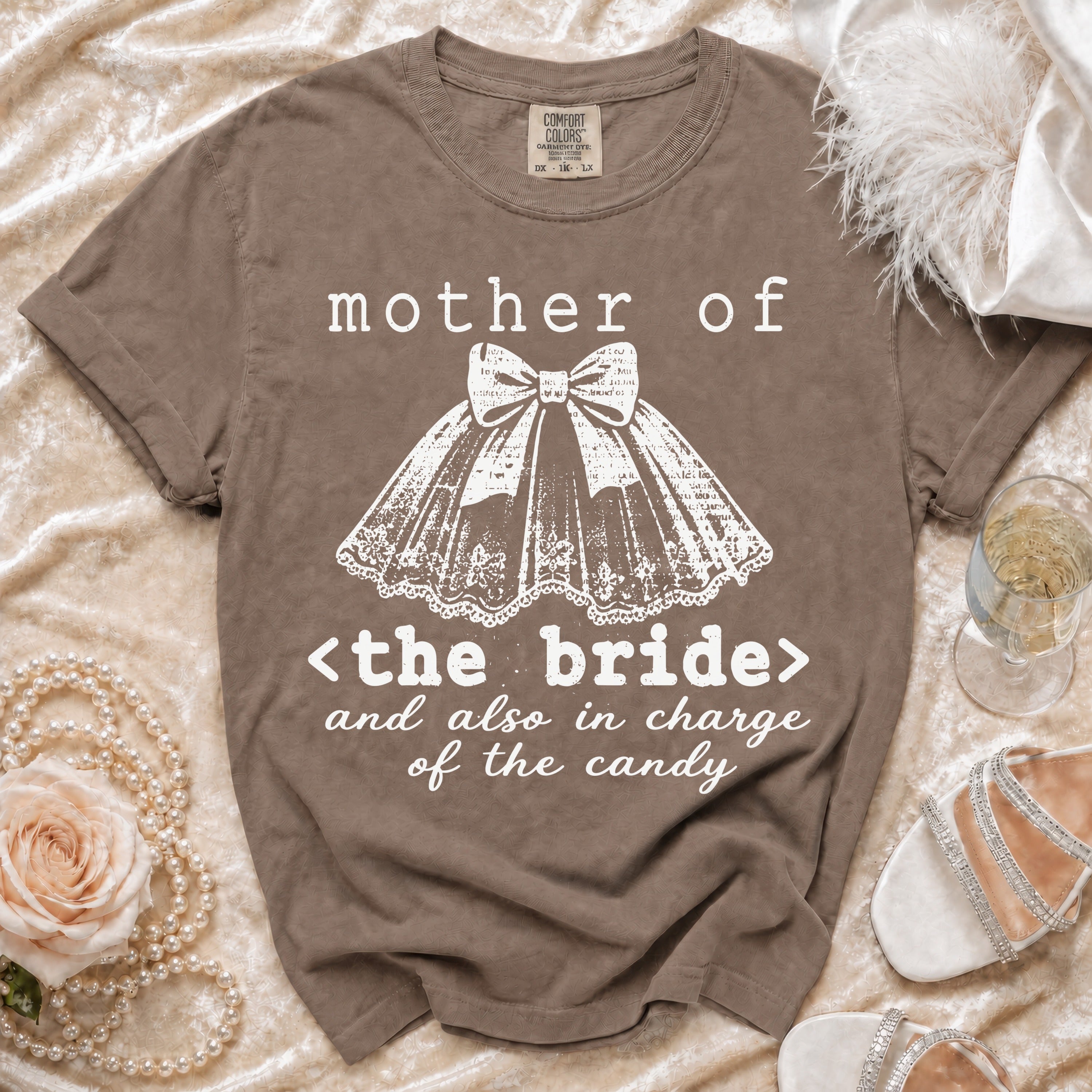 Brown t-shirt with "mother of <the bride> and also in charge of the candy" text.