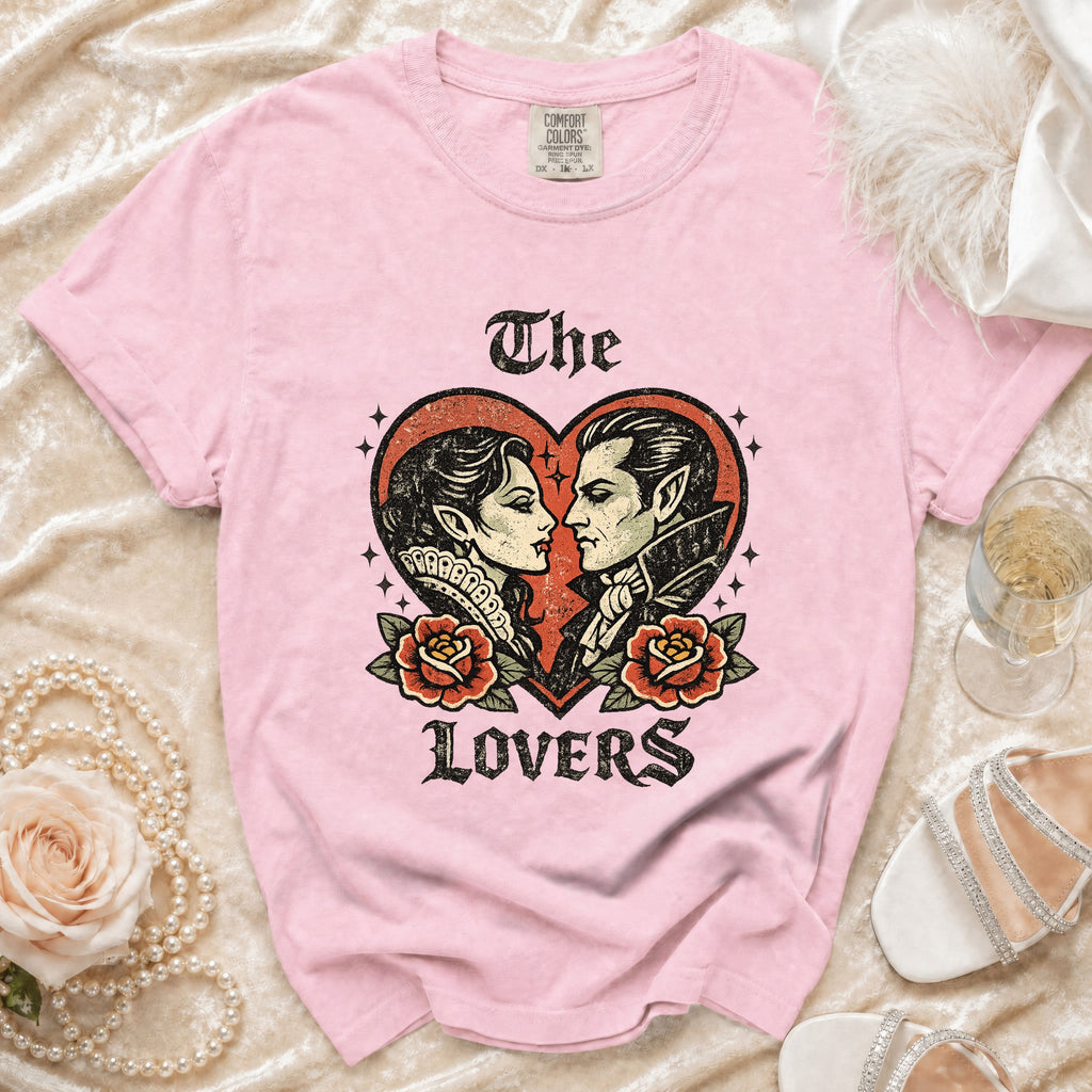 Pink t-shirt with a distressed graphic of vampire lovers and roses.