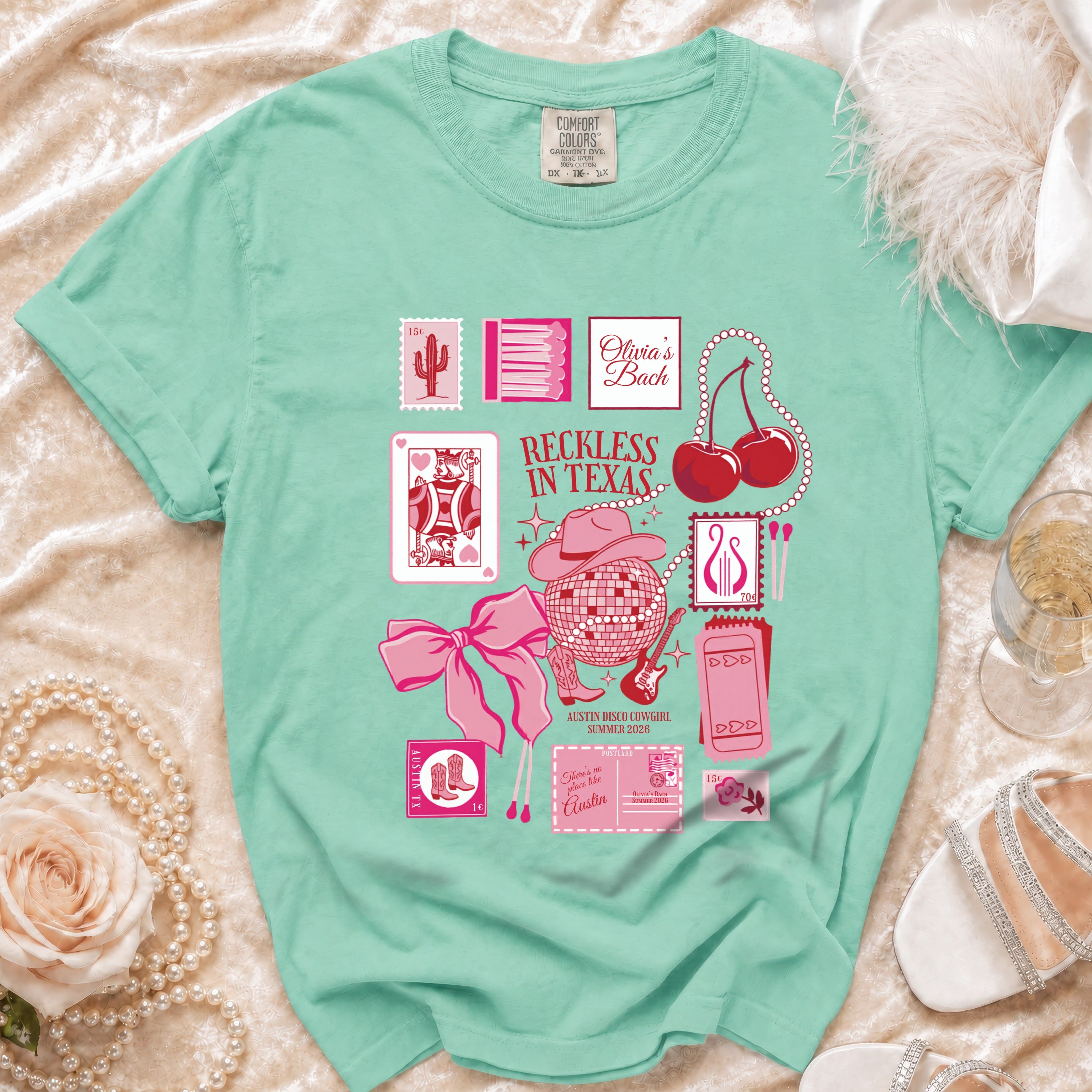 Mint t-shirt with "Reckless in Texas" and Olivia's Bach Austin Disco Cowgirl graphics.