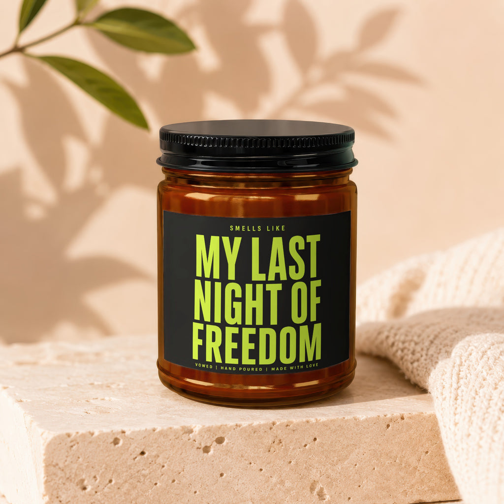 Scented candle with black lid reading "My Last Night of Freedom."