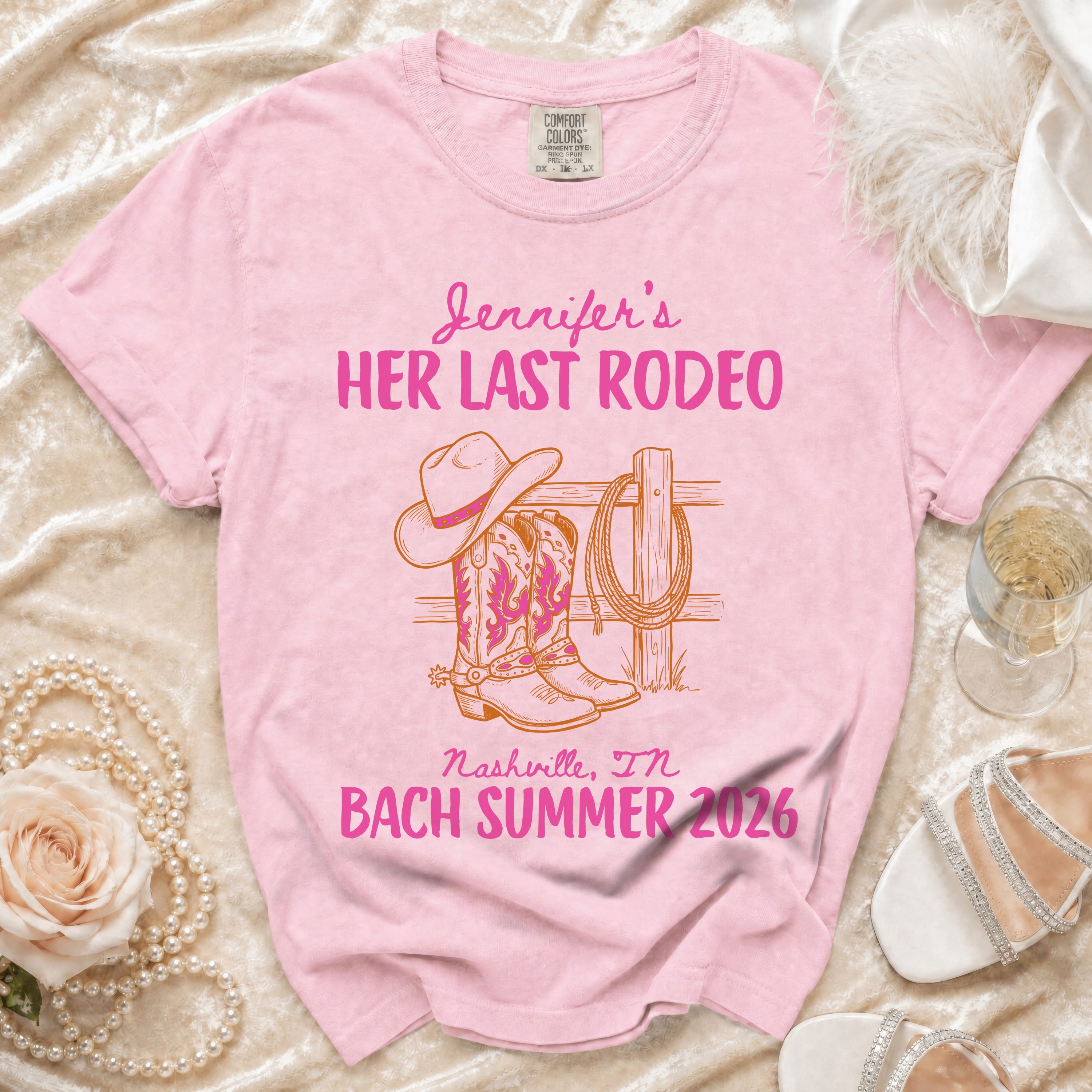 Pink t-shirt with "Jennifer's HER LAST RODEO Nashville, IN BACH SUMMER 2026" text and cowboy boots.