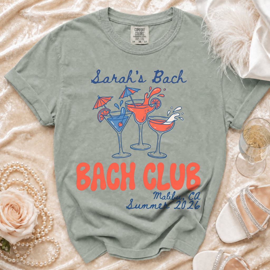 Sage green t-shirt with "Sarah's Bach" and "Bach Club Malibu, Ca Summer 2026" text.