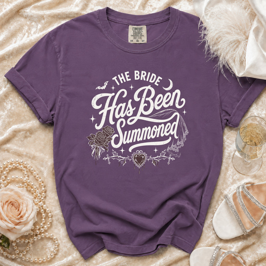 Purple t-shirt with "The Bride Has Been Summoned" gothic wedding text.
