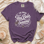 Purple t-shirt with "The Bride Has Been Summoned" gothic wedding text.