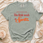 Sage green shirt reading "Spritz Social Club This Bride needs a Spritz."