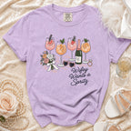Purple t-shirt with "Wifey Wants a Spritz" graphic and cocktail illustrations.