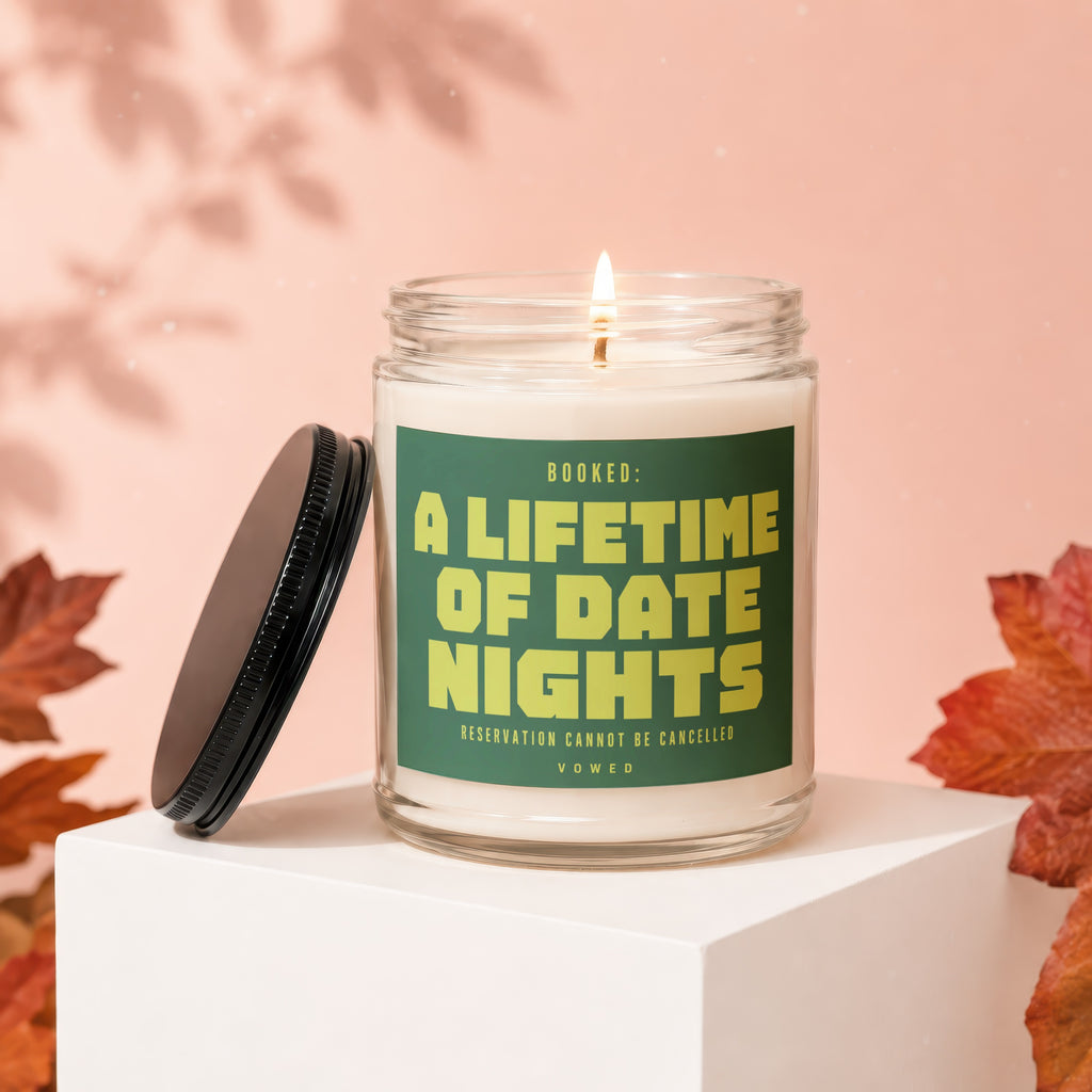 Jar candle with lid off, featuring text "BOOKED: A LIFETIME OF DATE NIGHTS RESERVATION CANNOT BE CANCELLED".