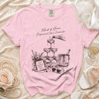 Pink t-shirt with "Maid of Honor. Professional Chaos Coordinator." text and champagne illustration.