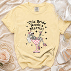 Yellow t-shirt graphic with skeleton bride saying "This Bride Needs a Martini".