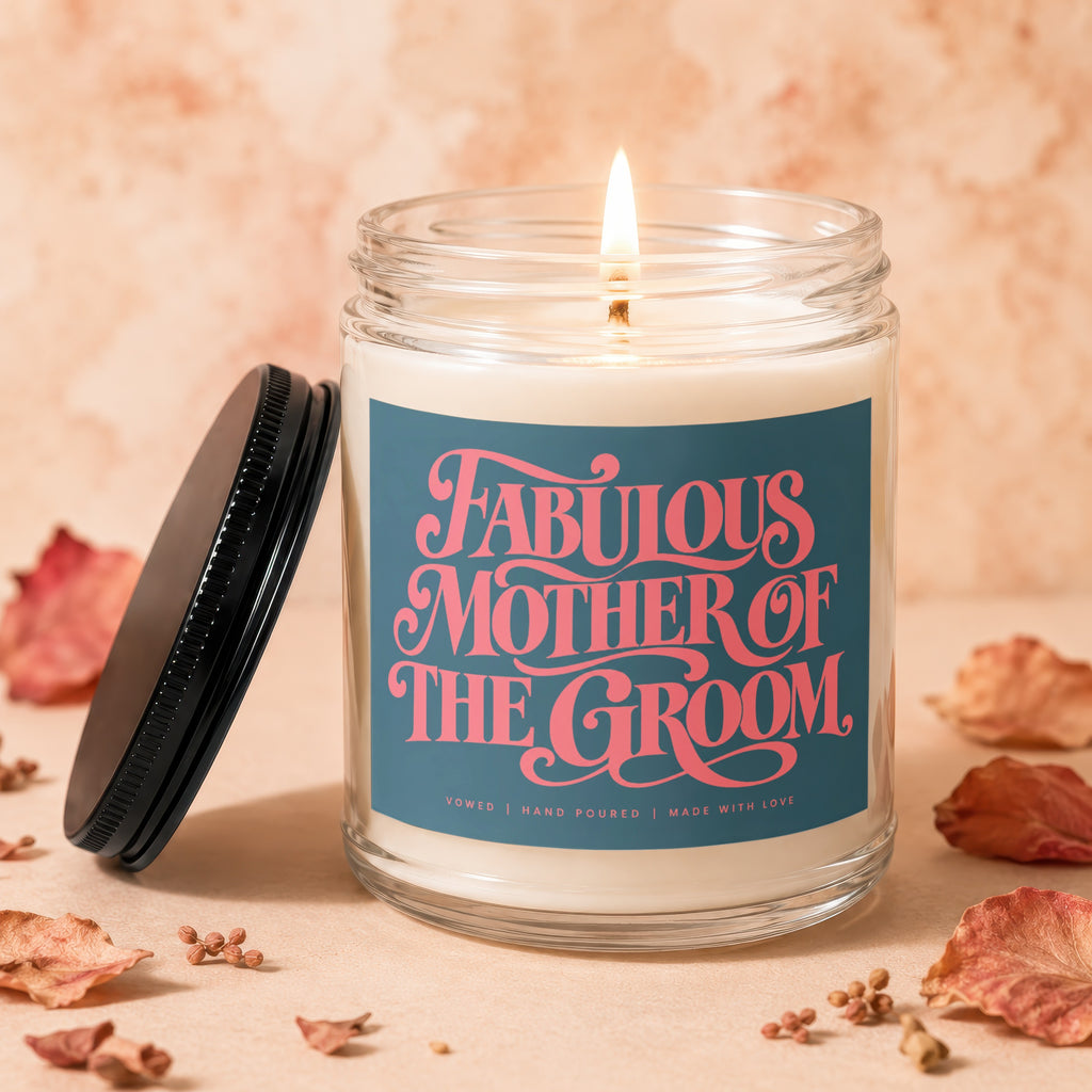 Candle labeled "Fabulous Mother of the Groom" with a lit wick.