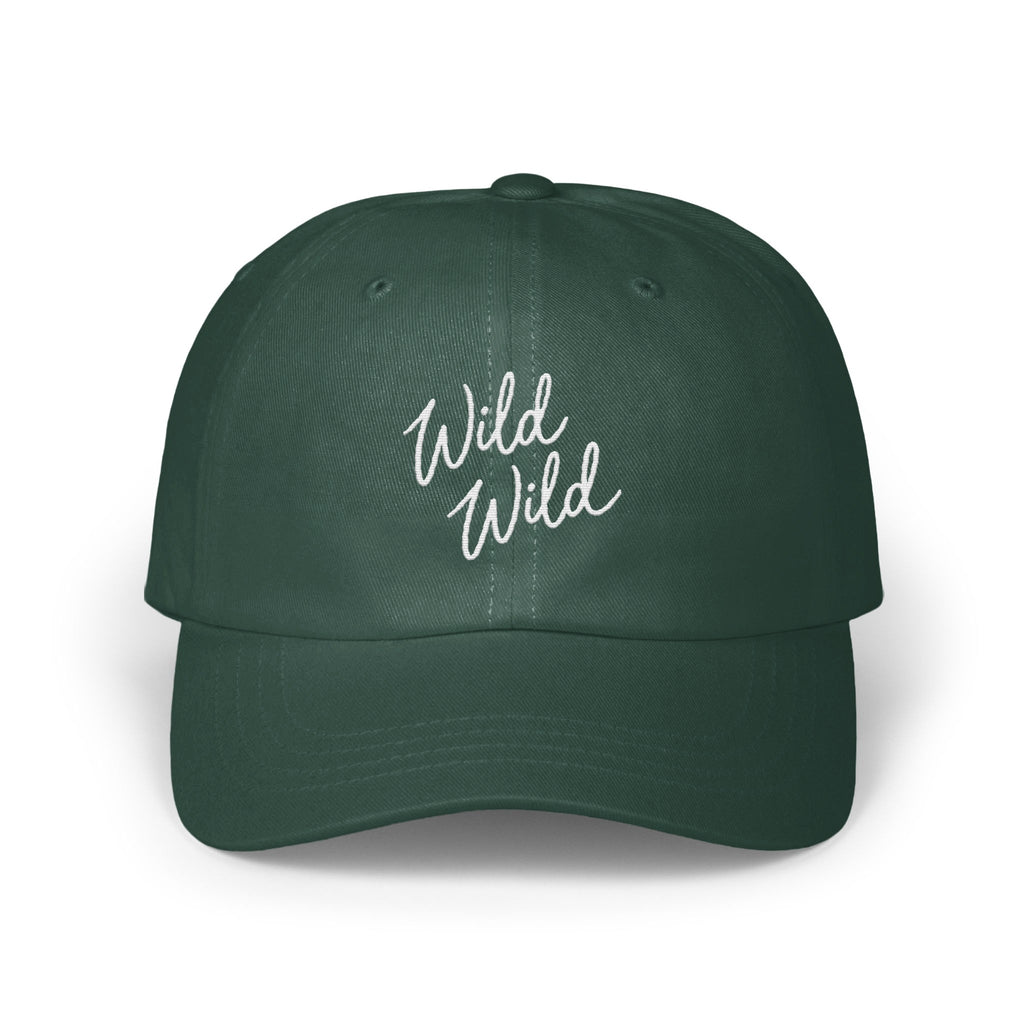 Dark green dad hat featuring white cursive text reading "Wild Wild" centered on the front panels.