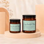 Two candles labeled "Mother of the Bride" with a quote about a bride's mother.