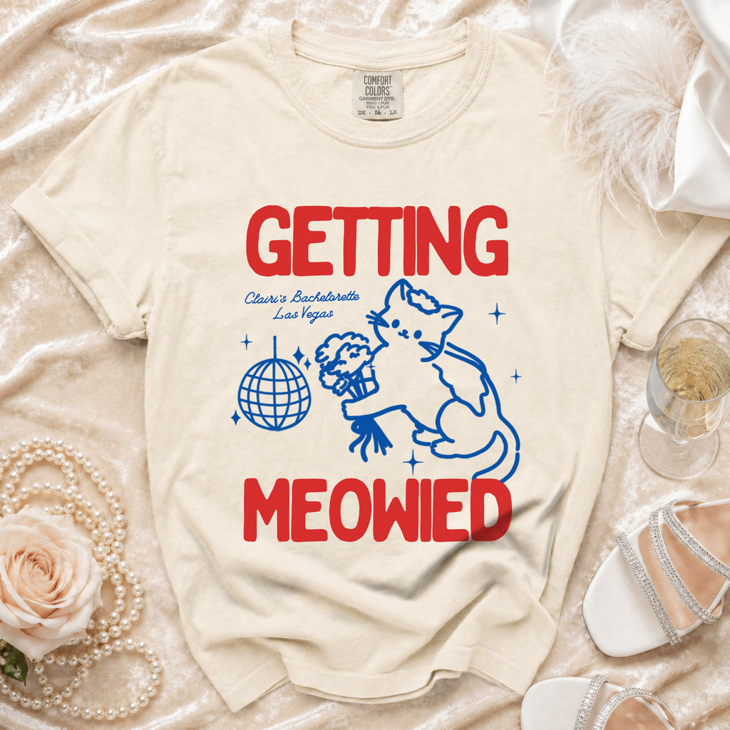 Cream t-shirt with "GETTING MEOWIED" text, cat, disco ball, and bachelorette details.
