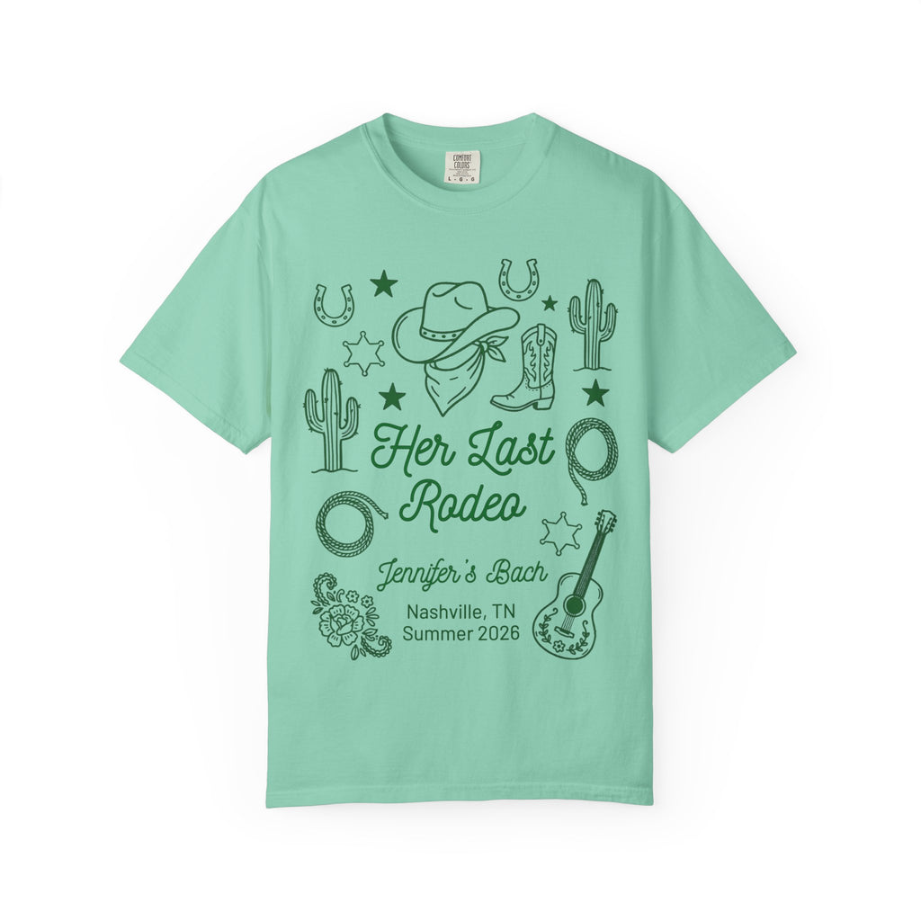 Teal t-shirt with "Her Last Rodeo" and western graphics.