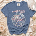 Blue shirt with "Mother of the Bride" design, featuring a coffee cup and text about grace and group chats.