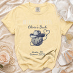 Light yellow t-shirt with "Reckless in Texas Olivia's Bach Austin, TX Summer 2026" text.