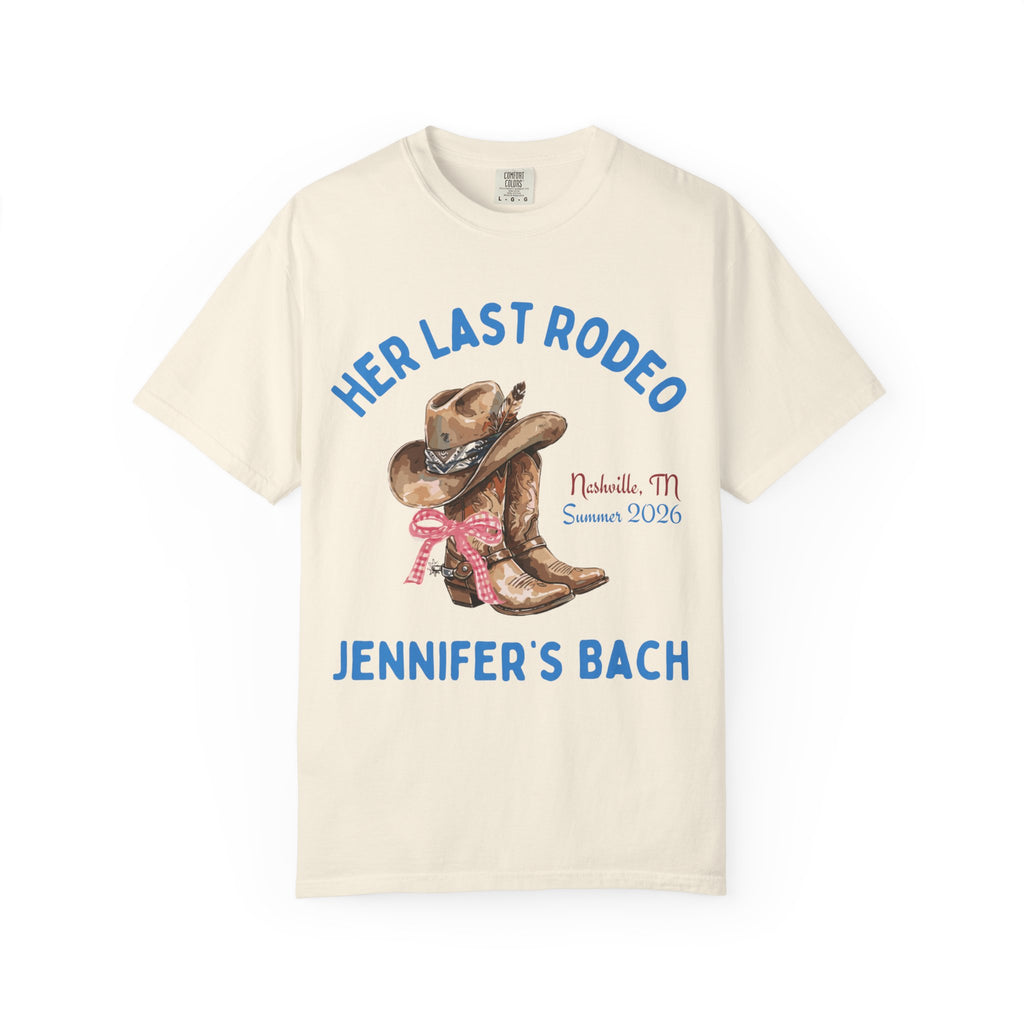 Cream t-shirt with cowboy boots, hat, "Her Last Rodeo" text, and "Jennifer's Bach"